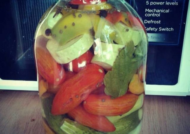 Pickled assorted tomatoes with cucumbers, zucchini, cabbage