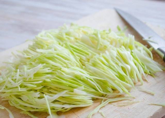 Pickled cabbage in jars with vinegar