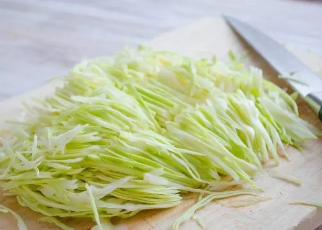 Pickled cabbage in jars with vinegar