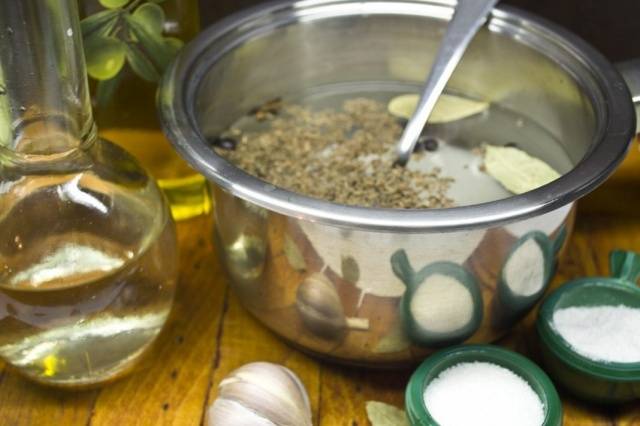 Pickled cabbage in jars with vinegar