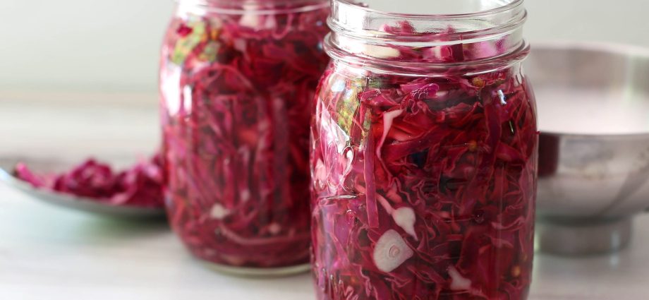 Pickled cabbage in jars with vinegar