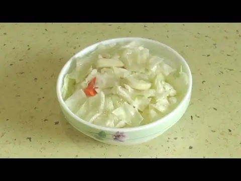 Pickled cabbage with garlic, butter and carrots