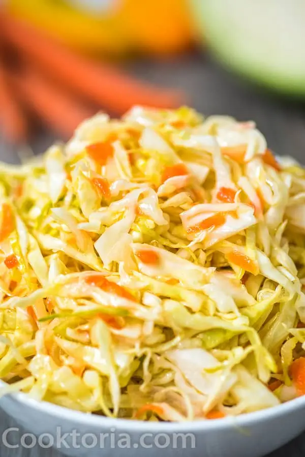 Pickled cabbage with garlic, butter and carrots