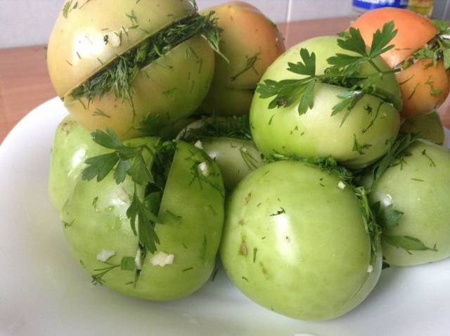 Pickled green tomatoes with hot peppers