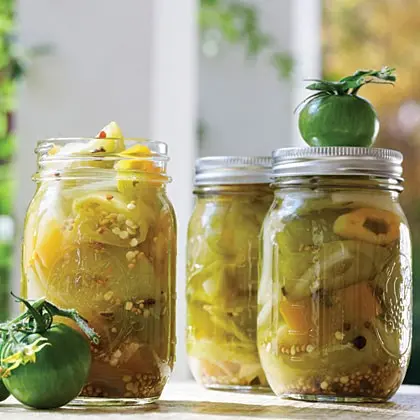 Pickled green tomatoes with hot peppers