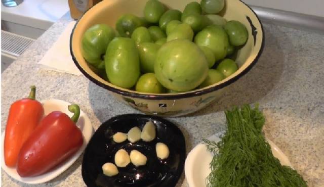 Pickled instant green tomatoes in a pot