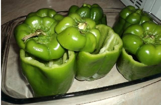 Pickled instant green tomatoes in a pot