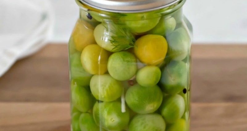 Pickled instant green tomatoes in a pot