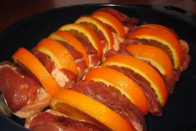 Pork with oranges baked in the oven: in foil, with sauce