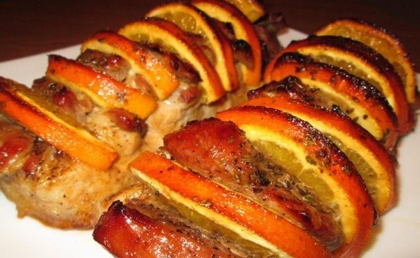 Pork with oranges baked in the oven: in foil, with sauce