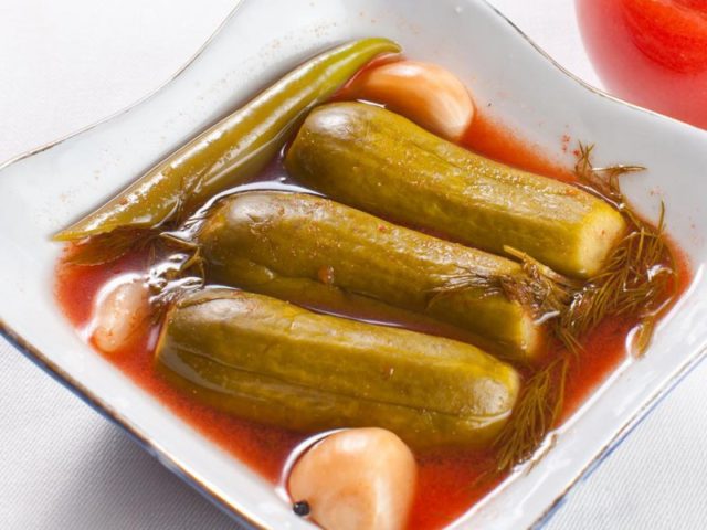 Recipes for cucumbers in tomato juice for the winter: pickling and canning rules