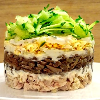 Salads with champignons and ham for the festive table