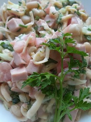 Salads with champignons and ham for the festive table