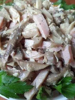 Salads with champignons and ham for the festive table