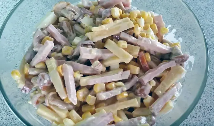 Salads with champignons and ham for the festive table