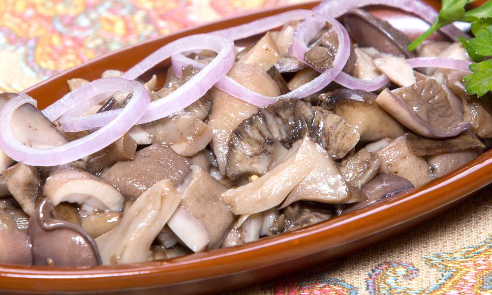 Salted and pickled milk mushrooms with butter for the winter