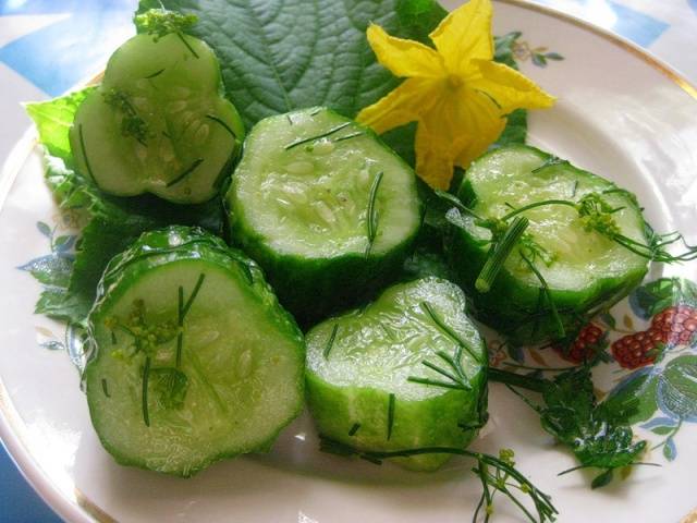 Salted cucumbers in hot brine