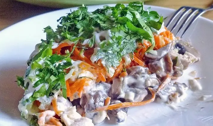 Spicy salads with canned champignons