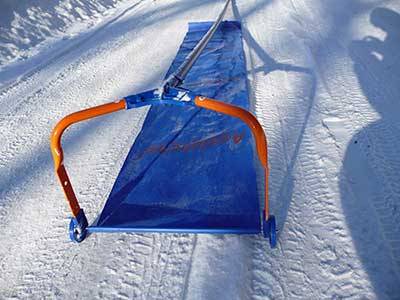 Telescopic shovel for removing snow from the roof