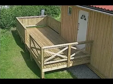 Terrace made of wood: open, attached to the house, with a canopy, made of logs, construction according to the scheme step by step