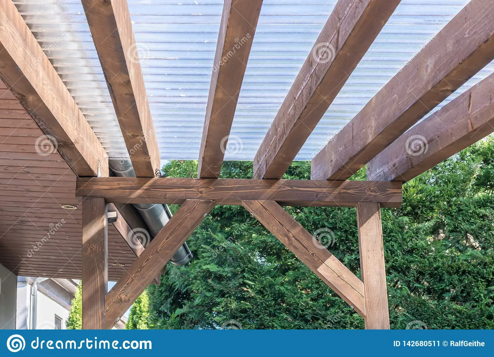 Terrace made of wood: open, attached to the house, with a canopy, made of logs, construction according to the scheme step by step