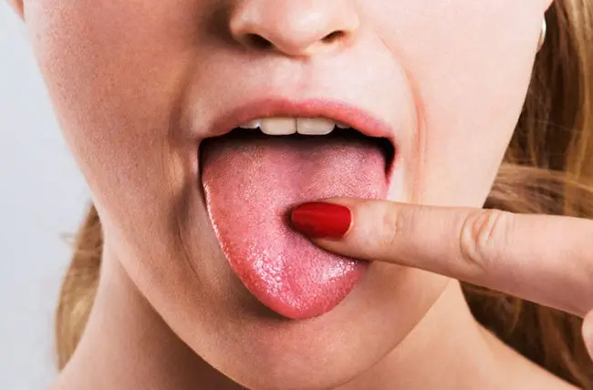 What causes a salty taste in the mouth?