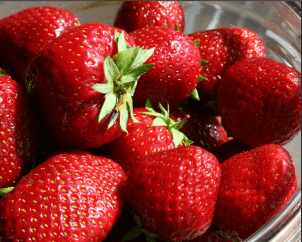 Why are strawberries red but sour?