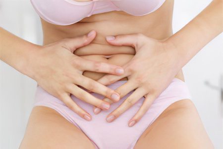 Why does the lower abdomen hurt in women?