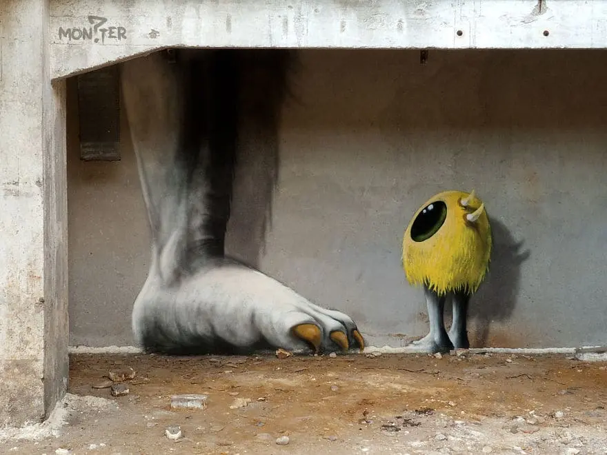 An artist draws monsters on the walls of abandoned buildings in Berlin