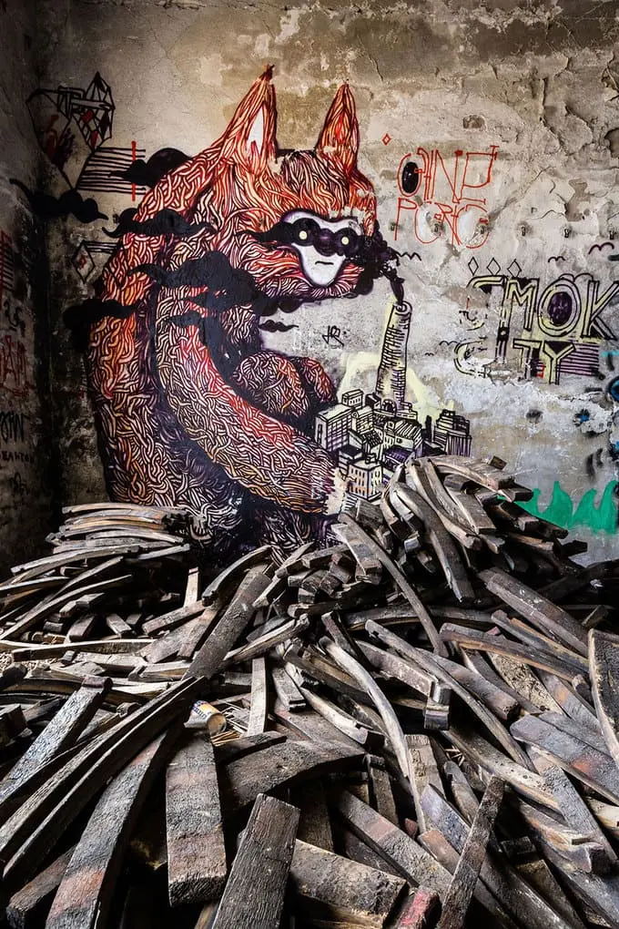 An artist draws monsters on the walls of abandoned buildings in Berlin