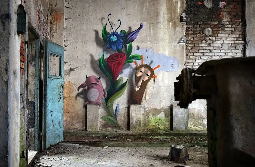 An artist draws monsters on the walls of abandoned buildings in Berlin