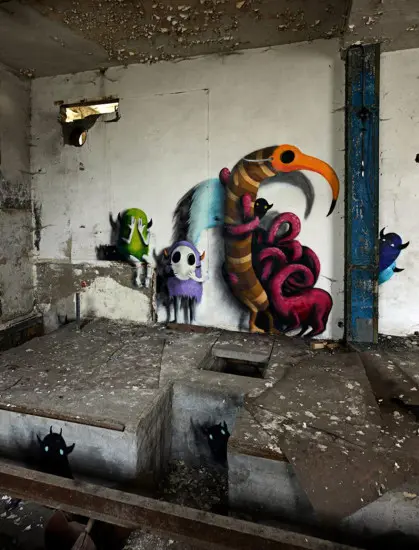 An artist draws monsters on the walls of abandoned buildings in Berlin