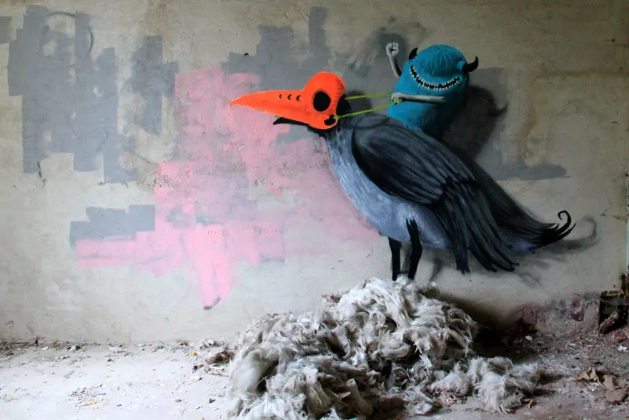 An artist draws monsters on the walls of abandoned buildings in Berlin