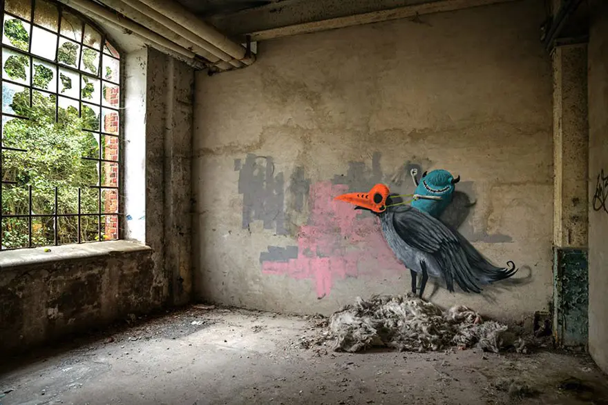 An artist draws monsters on the walls of abandoned buildings in Berlin