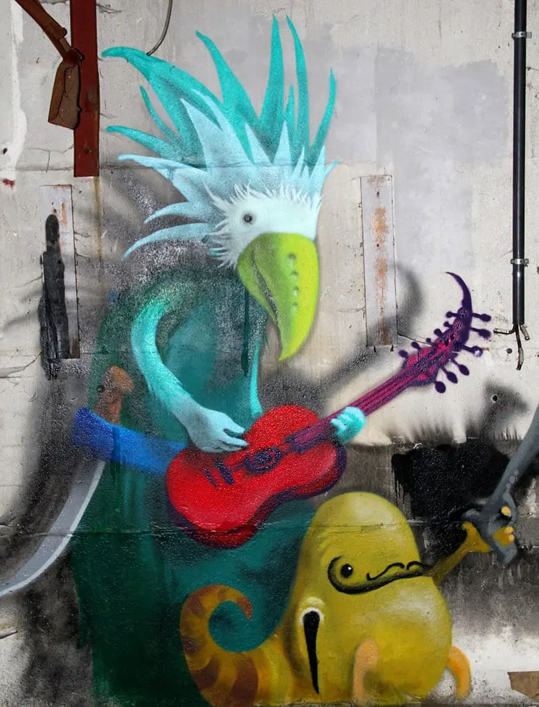 An artist draws monsters on the walls of abandoned buildings in Berlin