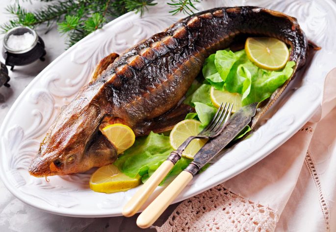 Baked sturgeon in the oven: delicious recipes whole and in pieces