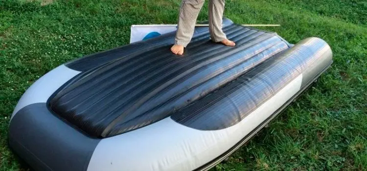 PVC boat with an inflatable bottom under the motor