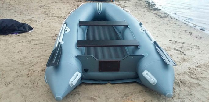 PVC boat with an inflatable bottom under the motor