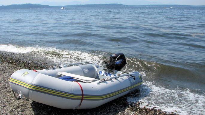 PVC boat with an inflatable bottom under the motor