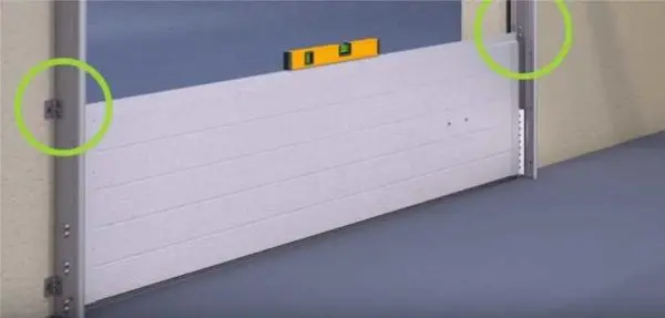 Do-it-yourself installation of sectional doors: measurements, preparation of the opening, installation