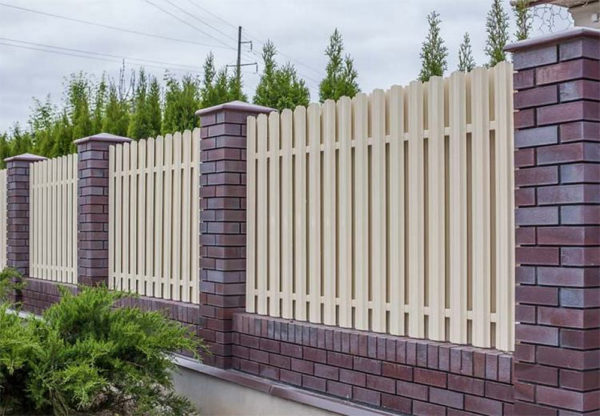 Fence from a metal picket fence: types, installation, photo